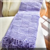 D073. Knit purple throw blanket.  